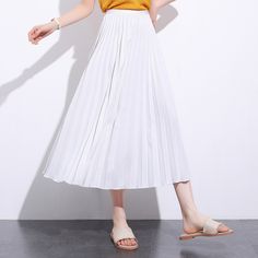 Exude elegance and class in our Solid Pleated Ankle Length Skirt. Featuring a long fit and elasticated waistband, this skirt is sure to keep you feeling comfortable and looking stylish all day long. Perfect for everyday wear, this versatile piece may be paired with a sweater or blouse for an effortlessly chic look to wear for casual days out or informal settings. Casual Flowy Ankle-length Maxi Skirt, Casual Ankle-length Flowy Maxi Skirt, Stretch Pleated Midi Skirt, White Relaxed Pleated Skirt With Elastic Waistband, Spring Full Maxi Skirt With Elastic Waistband, High Waist Skirt With Elastic Waistband And Relaxed Fit, Relaxed High Waist Skirt With Elastic Waistband, Flowy High Waist Summer Skirt, High Waist Skirt With Elastic Band