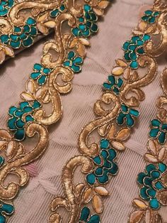 "Decorative zari golden  Phirozi Fabric Lace Sari Border Blouse Lace scarf Lace Indian Trim Fabric Trim-Price per 01 Yard-Width 1.5 Inch NFL344 \"Price for 01 yard\" PRODUCT CODE-NFL344 Width-1.5inch COLOR-GOLDEN Phirozi Can be used for- Dress, Craft projects  Hand bags, Hand accessory Purses, other decorative items. For wholesale order Kindly contact at ETSY Heavy discounts available..." Chanderi Dupatta With Gold Embroidery, Gold Chanderi Choli With Traditional Drape, Gold Bollywood Choli With Embroidery, Gold Choli With Gold Embroidery For Festive Occasions, Unstitched Gold Choli For Eid, Gold Traditional Drape Saree For Party Wear, Gold Saree With Traditional Drape For Party, Green Traditional Wear With Gold Embroidery For Eid, Unstitched Traditional Wear In Gold With Gold Embroidery