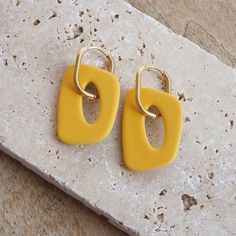 Beautiful polymer clay hoop earrings in organic shapes. You can also wear the golden hoop earrings without the clay charms. So you have two different earrings in one - a plain pair of gold hoop earrings and a colorful pair of larger hoop earrings :) Length: 5cm Width: 2.5cm Hoops: stainless steel I made the earrings from polymer clay. They are very light and comfortable to wear. The manufacturing process begins with shaping, after which the pieces are placed in the oven, where they acquire their Polymer Clay Hoop Earrings, Clay Hoop Earrings, Golden Hoop Earrings, Different Earrings, Pinterest Contest, Golden Hoops, Polymer Clay Bracelet, Clay Pendants, Clay Inspo