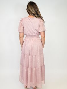 Women's tiered midi dress Blush with gold metallic dots Short sheer sleeves Smocked detail at waist Split V-neckline Lined dress Back length of dress - 51" Available sizes: Small, Medium, and Large Material: 100% Polyester Care Instructions: Hand wash cold/ do not bleach/ lay flat to dry Model is 5'6", size 4/6 and wearing a size small Feminine Tiered Dress With Elastic Waistband, Dress Back, Tiered Midi Dress, Lovely Things, Sheer Sleeves, Dress Romper, Cardigan Jacket, Vest Dress, Dress Backs