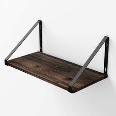 a wooden shelf with metal brackets on it