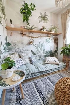 a living room filled with lots of plants