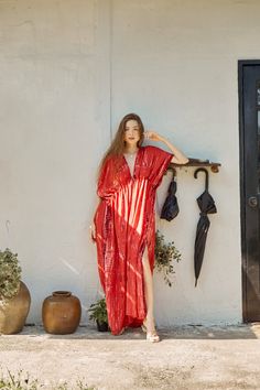 Switch to vacay mode anytime with the Goddess - Tie Dye Kaftan Maxi Dress in red coral. This undeniably sexy, breezy maxi dress will have you dreaming of the wind in your hair, the sound of the ocean waves, and the sand under your feet. Experience blissful comfort and breathability whether you’re at home or on vacay with the gorgeous flowy long dress and laid-back loose fit. Crafted in 100% soft, lightweight rayon, this dress features flawless tie-dye patterns and is perfect for tropical beachsi Red V-neck Dress For Vacation, V-neck Maxi Dress For Beach Cover-up During Resort Season, Red V-neck Maxi Dress For Beach Party, Bohemian V-neck Maxi Dress For Resort, Red V-neck Beach Dress For Vacation, Red V-neck Beach Dress For Beach Season, Red Maxi Dress For Beach Cover-up, Red Flowy Summer Maxi Dress, Flowy Red Summer Maxi Dress