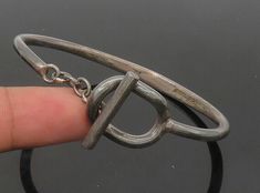 "925 Sterling Silver - Vintage Dark Tone Chained Loop Bangle Bracelet - BT8453  Jewelry Type:         Bracelet  Metal Type:            925 Silver  Metal Size:             6.75\" Length  .75\" Height   Stone Type:            N/A  Condition:              N/A  Jewelry Weight:     20.9 Grams  PLEASE NOTE: THIS ITEM IS PRE-OWNED. ALTHOUGH MOST ITEMS ARE IN VERY GOOD CONDITION, SOME MAY NEED CLEANING AND/OR MINOR REPAIRS. WE MAKE A VERY STRONG EFFORT TO UPLOAD CLEAR PICTURES. PLEASE INSPECT ALL PICTURES AND ASK ALL QUESTIONS YOU MAY HAVE PRIOR TO MAKING A PURCHASE. NOT ALL STONES ARE GENUINE, SOME ARE ENHANCED OR CREATED." Silver Smithing, Clear Pictures, Bracelet Metal, Chain Loop, Jewelry Inspo, Metal Bracelets, Bangle Bracelet, Types Of Metal, Metallic Silver