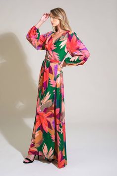 A printed woven maxi dress featuring surplice neckline, true wrap with tie and long sleeve Details: Self : 100% Polyester Lining : 100% Polyester Size & Fit - Model is 5`8" And Wearing Size Small- Measurements Taken From Size Small- Approx. Length: 60" Green V-neck Maxi Dress With Tie Waist, Green V-neck Wrap Dress For Spring, Vibrant Print V-neck Maxi Dress For Brunch, Green Tie Waist Wrap Dress For Vacation, Chic Green V-neck Maxi Dress, Green Long Sleeve Maxi Dress For Fall, Green Maxi Dress For Fall, Green Floral Print Long Sleeve Maxi Dress, Printed Maxi Wrap Dress For Spring