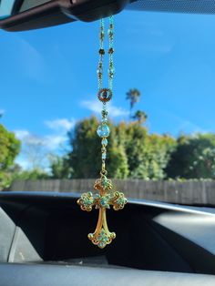 a rosary hanging from the side of a car