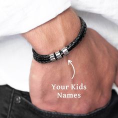 "Introducing the perfect gift for any proud dad - our personalized leather bracelet! Handcrafted with premium leather and adorned with sleek silver beads, this bracelet exudes a timeless, masculine charm. Each silver bead is intricately engraved with the names of your beloved kids, creating a heartfelt and meaningful keepsake. With its adjustable clasp, this bracelet ensures a comfortable fit for every wrist size. Showcasing the love and bond between a father and his children, this personalized Classic Leather Bracelet For Gift, Classic Leather And Stainless Steel Bracelet For Gift, Father's Day Black Leather Jewelry, Personalized Black Leather Bracelet For Father's Day, Modern Everyday Wristband For Father's Day, Modern Wristband For Everyday And Father's Day, Personalized Black Leather Bracelet For Everyday, Personalized Black Leather Bracelet For Gift, Personalized Black Leather Bracelet With Stainless Steel