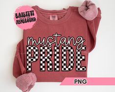 a red shirt with the words mustang pride printed on it and two pink mittens