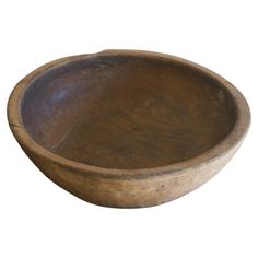 a wooden bowl is shown on a white background