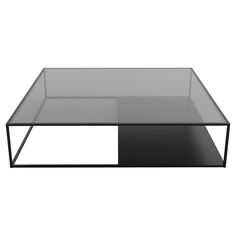 a glass and metal coffee table on a white background