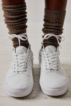 In classic Vans fashion, these skater sneakers were the first to bare the iconic side stripe. Canvas uppers with suede contrast and a padded footbed for extra comfort and support. | UA Old Skool Sneakers by Vans at Free People in White, Size: US 4.5 M Everyday Fall Sneakers With Gum Sole, Fall Everyday Sneakers With Gum Sole, Fall Gum Sole Lace-up Sneakers, Classic Fall Streetwear Sneakers, White High-top Sneakers With Vulcanized Sole For Fall, Winter Low-top Sneakers With Contrast Sole, Leather Skate Shoes With White Laces For Streetwear, White Everyday Sneakers For Fall, Suede Sneakers For Streetwear In Winter