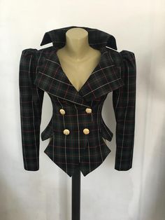 This is a very stylish and elegant jacket . Leght  58cm - at back. Fully lined. A jacket especially made to turn heads and give you that wow factor :) Vintage style leg o mutton sleeves.SIZE CHARTSIZE S - US 6, UK 8, EU 36bust: bust around 34.5”/90cmWaist: waist around 27.5”/70cmHips: hips around 34.5”/90cmSIZE M - US 8, UK 10, EU 38bust: bust around 37.5”/95cmWaist: waist around 29.5”/75cmHips: hips around 37.5”/95cmSIZE L - US 10, UK 12, EU 40bust: bust around 39.5"/100cmWaist: waist around 31 Plaid Corset Top, Elegant Plaid Tweed Jacket With Button Closure, Fitted Double-breasted Tweed Jacket With Buttons, Tailored Plaid Long Sleeve Blazer, Tailored Plaid Blazer With Long Sleeves, Elegant Double-breasted Plaid Blazer, Elegant Plaid Blazer With Buttons, Winter Plaid Blazer With Buttons, Chic Fitted Double-breasted Tweed Jacket