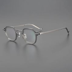 Discover the perfect blend of style and durability with the Hewei Unisex Full Rim Round Acetate Titanium Eyeglasses (Model Number: 1314157). These eyeglasses are designed for individuals who appreciate modern aesthetics and superior craftsmanship. With a fashionable round shape, they are suitable for both men and women, making them a versatile addition to any wardrobe. Crafted from a premium combination of acetate and titanium, these eyeglasses offer a lightweight yet sturdy frame. The acetate p Silver Round Frame Sunglasses With Metal Frame, Silver Round Frame Metal Sunglasses, Modern Silver Round Frame Sunglasses, Classic Silver Glass Sunglasses, Gray Square Frame Glass Sunglasses, Modern Gray Sunglasses For Formal Occasion, Classic Silver Anti-reflective Sunglasses, Formal Silver Anti-reflective Sunglasses, Modern Gray Glass Sunglasses