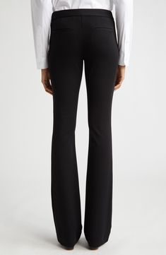 Staple black trousers fit slim through the leg before kicking out into a fun flare at the hem. 33 1/2" inseam; 22" leg opening; 10" front rise; 16" back rise (size 16) Zip fly with hook-and-bar closure Back welt pockets Lined 68% viscose, 28% polyamide, 4% elastane Dry clean Imported Designer Clothing Classic Mid-rise Fitted Flares, Classic Fitted Mid-rise Flares, Fitted Mid-rise Formal Pants, Formal Fitted Mid-rise Pants, Stretch Elastane Pants With Standard Cut Leg, Black Fitted Flares For Night Out, Classic Black Flare Bottoms, Stretch Straight Flares For Workwear, Formal Black Pants With Minimal Stretch