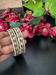 Simple Mehendi finished kundan pearl bangles in size 2.4  & 2.6 inches ! Product care: Avoid contact with Chemicals such as Perfumes or any Sprays. Prevent the Jewellery from the water. Use Butter Paper or Cotton Cloth to store your Jewellery for a longer Product life. White Stone Work Wedding Gift, Elegant Adjustable Bangle For Diwali, White Bollywood Bangle For Wedding, Bollywood Style White Wedding Bangle, White Bollywood Style Wedding Bangle, White Wedding Bangle For Festive Occasions, White Wedding Bangle For Festive Season, Festive White Wedding Bangle, Adjustable Round Bangle For Diwali