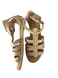 Brand: CLOTHES MENTOR Style: SANDALS FLATS Color: TAN Size: 6 Other Info: SHIBEVER - SIZE 36 SKU: 186-186278-19482 CONDITION: GENTLY USED Beige T-strap Sandals With Round Toe For Beach, Beige Round Toe T-strap Sandals For Beach, Beige T-strap Sandals For The Beach, Casual T-strap Sandals With Buckle For Vacation, Casual T-strap Sandals With Buckle Closure For Vacation, Beige Closed Toe T-strap Sandals For Beach, Beige T-strap Sandals With Ankle Strap For Vacation, Beige T-strap Sandals For Beach In Spring, Beige T-strap Sandals For Spring Beach Outings