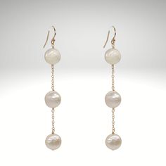 Drop coin pearl earrings that luster. 14k gold filled 3" drop length handmade in Los Angeles freshwater pearls Please note that all pearls will be slightly different than the one pictured. They will be similar in shape and size, but as each pearl is grown individually they are not going to be exactly the same. 14k Gold Filled Pearl White Dangle Pearl Earrings, 14k Gold Filled Pearl Drop Earrings In Pearl White, White Pearl Drop Linear Earrings In 14k Gold Filled, White Long Drop Pearl Earrings In 14k Gold Filled, White Long Drop Pearl Earrings In 14k Gold, Long Drop Pearl Earrings With Ear Wire, 14k Gold Filled White Pearl Drop Linear Earrings, White 14k Gold Filled Pearl Drop Linear Earrings, Long Drop Pearl Chain Earrings 14k Gold Filled