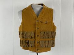 Vintage 1930s hunting, shooting vest. Made of rust brown cotton flannel. Has a button down front single chest pocket, and 24 shotgun shell pockets. Missing label, about a size 40" at the waist   13" shoulder to shoulder   22.5" overall length  In very good condition, with minor frayed edge bottom right front, see picture. Utility Hunting Vest Sleeveless, Utility Sleeveless Hunting Vest, Vintage Cotton Vest For Outdoor, Vintage Khaki Vest For Fall, Vintage Khaki Vest For Outdoor, Flannel Vest, Hunting Vest, Vintage Hunting, Shotgun Shell