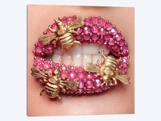 a woman's lips with pink beads and bees on them