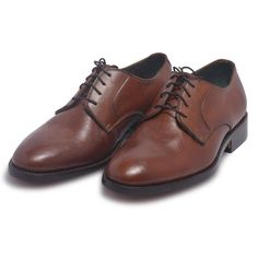 Upgrade your shoe collection with these brown derby genuine leather shoes from the LeatherSkinShop. The handmade design is crafted with care down to the details and comes in the neutral shade of brown to go with most of your dresses. Some of the noteworthy features of these brown derby genuine leather shoes include: The handmade design is crafted to maximize your foot comfort The pair of shoes bears laces with fine details to give you an elegant design The shoes are made with high-quality genuine leather These shoes come in the color brown to complement most of the pieces in your wardrobe Set your style a class apart with this elegant design that is a work of brilliance and finesse. Brown Goodyear Welted Lace-up Derby Shoes, Brown Goodyear Welted Oxford Lace-up Shoes, Brown Goodyear Welted Almond Toe Oxfords, Brown Goodyear Welted Lace-up Leather Shoes, Brown Goodyear Welted Leather Lace-up Shoes, Brown Goodyear Welted Lace-up Dress Shoes, Brown Wingtip Leather Derby Shoes, Brown Cap Toe Goodyear Welted Lace-up Shoes, Brown Goodyear Welted Cap Toe Lace-up Shoes