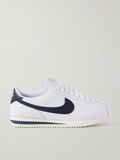 Nike won a debut gold with its 'Cortez' sneakers at the 1972 Olympics, so it's fitting the brand releases a fresh version in time for this year's games. Made from leather in a blue and white colorway, they feature the signature 'Swoosh' and logo heel tab accented with gold lettering. The mesh lining ensures breathablity. Net A Porter Sneakers, Classic Nike Sneakers With Contrast Sole, Nike Retro Leather Sneakers, Retro Nike Leather Sneakers, Classic Nike Custom Sneakers With Gum Sole, Nike Classic Leather High-top Sneakers, Nike Custom Sneakers With Perforated Toe Box, Classic Nike Custom Sneakers With Perforated Toe Box, Nike Cortez White