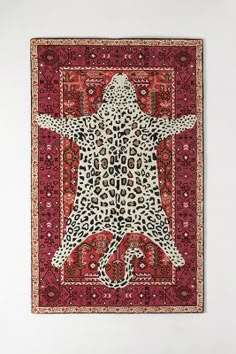 an animal print rug hanging on the wall