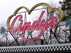 a large neon sign that says candy's run