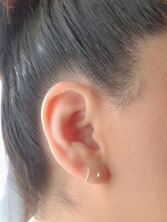 This Dainty Spiral Twist Earrings for Single Pierced Ears is very comfy and lightweight, perfect for every day wear and you only need 1 piercing hole in your ear to wear it!! It will look like if you are wearing 2 earrings: 1 Ball stud and 1 Hoop. QUANTITY: 1pair. MEASUREMENTS:  Diameter 7- 8 mm        Thickness - 20 gauge, standard post size MATERIALS: Solid Sterling Silver FEATURES: * Water and Tarnish resistant, shower safe. * Nickel & Lead Free (Hypoallergenic) Safe for sensitive skin. * Made of 100% Top quality USA materials. PACKAGING: Your new jewelry ships nicely wrapped in a jewelry gift box, ready for gift giving! ◇ At Sparkling Hearts Designs we love our clients and our planet, that's why our packaging is not just beautiful but is also made from recycled or reusable materials. ◇ Ear Piercing Hoop, Fake Ear Piercings, Twist Earrings, Fake Earrings, 2 Earrings, Spiral Earrings, Minimal Jewelry, Cartilage Piercing, Ear Piercing