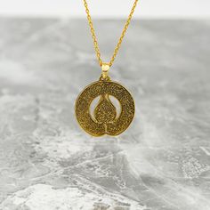 Crafted for the discerning Muslim woman, the Diwani Ayatul Kursi Necklace is a true masterpiece of Islamic jewelry. Made from high-quality 925 sterling silver and elegantly plated with 18K gold, this pendant is a blend of sophistication and faith. The intricate design featuring the Ayatul Kursi from the Quran adds a spiritual touch to any outfit. Whether worn as a daily reminder of faith or as a special gift, this necklace embodies both style and devotion. Elevate your jewelry collection with this symbolic piece that celebrates both beauty and faith in a subtle and elegant manner. Size of Pendant: 1x1" | 2.5x2.5 cm Weight of Pendant (Without Silver Chain): 0.14 oz | 3.8 gr Material of Pendant: 18K gold plated on Hypoallergenic 925 sterling silver. Length of Chain : 14 in - 35 cm | 16 in - Traditional Tarnish Resistant Pendant Jewelry, Amulet Necklace With Polished Finish For Anniversary, Traditional Pendant Necklace Tarnish Resistant, Traditional Medallion Jewelry With Polished Finish, Symbolic Intricate Design Necklace For Gift, Traditional Medallion Necklace With Polished Finish, Amulet Style Engraved Necklace For Anniversary, Traditional Polished Medallion Jewelry, Elegant Ceremonial Necklaces With Polished Finish