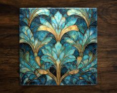 a blue and gold art work on wood