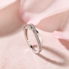 Simple in design, the ring is finished with a bright polished shine. Celebrate your commitment with this meaningful wedding band.Carat Weight: 0.29 ctStone Size: 1 mmStone Type: Jeulia® StoneNumber of Stones: 29 Stone Color: Diamond WhiteStone Shape: RoundWeight: 2.7 gWidth: 2.1 mmHeight: 2.3 mmThickness: 1.2 mmMaterial: 925 SilverPlating Color: Silver White Gold Half Eternity Promise Band, Sterling Silver Diamond Ring With Tension Setting For Anniversary, Diamond Half Eternity Open Band Ring, Diamond Open Band Half Eternity Wedding Ring, Elegant White Gold Crystal Ring With Open Band, Elegant Round Band Diamond Ring With Channel Set, Diamond Open Band With Half Eternity, Elegant White Gold Open Band Crystal Ring, Elegant Channel Set Diamond Ring With Round Band