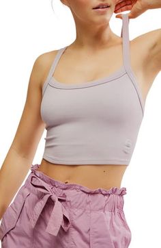 A cropped, racerback cut defines this rib camisole that's always ready for layering, lounging, lunging, lay-ups—you get the idea. 14" length (size Medium/Large) Scoop neck Racerback 87% polyamide, 13% elastane Dry clean or machine wash, dry flat By Free People; made in Turkey Spring Crop Top With Built-in Bra For Gym, Versatile Summer Sports Bra With Tank Straps, Versatile Sports Bra With Tank Straps For Summer, Seamless Summer Sports Bra For Everyday, Cropped Sports Bra For Spring, Spring Medium Support Crop Tank Top, Summer Cami Sports Bra For Loungewear, Spring Crop Top Tank With Medium Support, Spring Cropped Sports Bra With Adjustable Straps