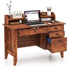 a laptop computer sitting on top of a wooden desk next to a drawer filled with books