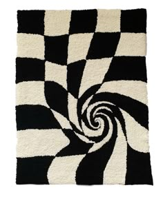 a black and white rug with a spiral design