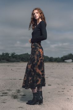 This tulip shaped midi skirt is made with 12 panels and a wide high waisted waist band. It has beautiful flow and movement and feels super soft and comfortable. Part of our tie-dye collection, it is a great piece for all seasons but especially for fall as it will give you serious witchy vibes. Made with our super soft buttery bamboo stretch jersey. Modest Fitted Skirt With Elastic Waistband, Bohemian Midi-length Flowy Maxi Skirt, Bohemian Style Lined Midi Skirt, Bohemian Midi Length Lined Skirt, Rayon Midi Skirt With Gathered Details, Rayon Midi Gathered Skirt, Rayon Gathered Midi Skirt, Flowy Rayon Flared Skirt, Asymmetrical Relaxed Maxi Skirt With Elastic Waistband