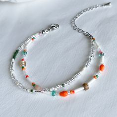 Add a vibrant flair to your look with this handmade beaded bracelet. Featuring a combination of orange and green beads, this bracelet is a unique, one-of-a-kind accessory. Adjustable length High-quality glass beads Handmade with love and care ✴︎Each design is created in extremely limited quantities, with only 1 or 2 pieces made per style. This exclusivity ensures that you are purchasing a truly unique piece of jewelry that stands out. Orange Beaded Chain Bracelet As A Gift, Orange Bracelet With Spacer Beads As Gift, Orange Friendship Bracelets With Colorful Beads, Orange Beaded Bracelets For Jewelry Making, Handmade Orange Friendship Bracelets With Round Beads, Gift Orange Bracelet With Spacer Beads, Handmade Orange Beaded Bracelets With Round Beads, Colorful Beads Friendship Bracelets In Orange, Orange Beaded Bracelets For Gift