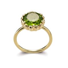 A vivid green peridot. This gem displays glorious chartreuse tone and is set in scalloped bezel on a minimalist band. The ring showcases the glorious  beauty of this magical stone, which happens to be the first gemstone to be discovered on Mars! It is a round flower-cut, measuring 10mm in diameter and is custom cut for Elegant Peridot Birthstone Ring With Prong Setting, Timeless Green Diamond Round Ring, Timeless Green Round Band Jewelry, Green Gemstone Diamond Ring With Round Band, Timeless Green Jewelry With Bezel Setting, Classic Green Diamond Ring With Bezel Setting, Green Peridot Birthstone Ring For Formal Occasions, Green Peridot Birthstone Ring For Formal Events, Elegant Green Birthstone Ring With Bezel Setting