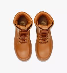 36 IT Visetos Boots in Calf Leather Cognac | MCM ®US Leather Moc Toe Boots For Streetwear, Leather Waterproof Boots With Vibram Sole For Streetwear, Leather Waterproof Boots For Streetwear, Leather Waterproof Boots With High Ankle For Streetwear, High-top Calf Leather Boots For Streetwear, Luxury Brown Calf Leather Moto Boots, Leather Moto Boots With Vibram Sole For Streetwear, Leather High Ankle Moto Boots For Streetwear, Luxury High-top Boots With Rubber Sole