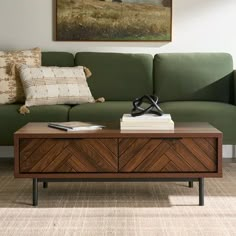 a living room with a green couch and coffee table