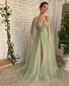 Aurora Cape Gown | Teuta Matoshi Tulle Prom Dress Long, Teuta Matoshi, Sequin Cape, Split Prom Dresses, Lace Cape, Prom Dresses 2023, Tulle Evening Dress, Prom Dress Long, Illusion Tulle