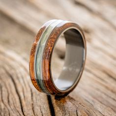 a wooden ring with silver and wood inlays