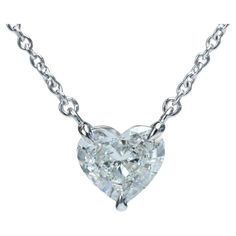 This new and finely made solitaire pendant necklace features a 1.59 carat G color VVS2 clarity heart brilliant cut natural diamond accompanied by an original GIA report.  The diamond is a bright white G color with a very clean VVS2 clarity that guarantees even upon close inspection with the naked eye that the stone will show no flaws. The pendant is soldered in line in a platinum basket setting on a sturdy 1.45mm width platinum chain. The necklace has an overall length of 16.5 inches that is per Platinum Chain, Diamond Heart Pendant Necklace, Basket Setting, Solitaire Pendant Necklace, Solitaire Necklaces, Heart Shaped Diamond, Heart Pendant Diamond, Heart Shape Pendant, Modern Necklaces