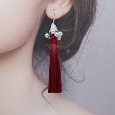 Elevate any outfit with these handmade tassel earrings. Made with premium silk tassels and faux pearl tassel caps, featuring a delicate filigree pattern. A perfect gift for New Year's or Christmas. Style them with a simple dress or blouse for an elegant look, pair with flowy top and denim for a bohemian vibe, or dress up a casual outfit with these statement earrings. Showcase the earrings fully by wearing your hair up, and perfect for special occasion like weddings or parties. ⚜Item Specifics ❀ Tassel Earrings For Wedding, Elegant Beaded Tassel Earrings, Elegant Red Jewelry With Latkans, Elegant Wedding Tassel Earrings With Latkans, Elegant Silver Tassel Earrings With Fringe, Handmade Elegant Tassel Earrings For Party, Elegant Tassel Earrings For Party, Handmade Red Tassel Earrings, Elegant Style, Dangle Tassel Earrings For Evening