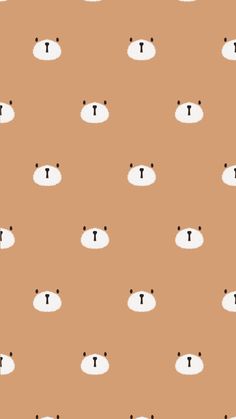 an animal pattern with the letter t on it's face and two small black dots