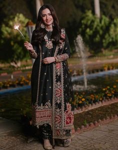 Royal Kameez Trouser Pakistani Black Dress for Wedding is an embroidered masterpiece that will give you an elegant look on the big day. Lavish designs and fine details make this beautiful Pakistani Wedding Dress an epitome of beauty and your foremost priority. Embroidered Kameez The beautiful kameez in the beautiful black color is adorned with graceful sheesha embroidery, tilla, and Resham. Embellished borders and sleeves give a perfect royal touch to the kameez, making it a perfect choice to pa Black Dupatta With Dabka For Reception, Black Dabka Dupatta For Reception, Black Gown With Dabka Work For Reception, Wedding Lehenga With Dabka Work In Black, Black Wedding Lehenga With Dabka Work, Elegant Embroidered Lawn Suit For Traditional Ceremonies, Black Traditional Wear With Intricate Embroidery For Wedding, Wedding Black Unstitched Suit With Chikankari Embroidery, Black Wedding Unstitched Suit With Chikankari Embroidery