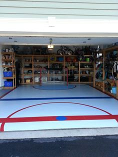 the inside of a garage with a basketball court and bike racks on it's sides