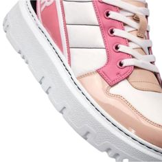 The D-player sneaker takes the classic basketball shoe and updates It In a couture version. The pink multicolor version Is crafted in a combination of technical fabric and calfskin and features patent details. Boasting a 'Christian Dior' signature band at the back, the contemporary sneaker is completed by a soft, lightweight sole.Round toeTreaded soleLace-upUpper: Technical Fabric, Leather; Sole: EVAMade in Italy Pink Leather Platform Sneakers For Streetwear, Modern Pink Sneakers With Translucent Outsole, Modern Pink High-top Sneakers, Pink Leather Custom Sporty Sneakers, Sporty Custom Pink Leather Sneakers, Sporty Pink Leather Custom Sneakers, Sporty Custom Patent Leather Lace-up Sneakers, Sporty Custom Lace-up Patent Leather Sneakers, Custom Patent Leather Lace-up Sneakers