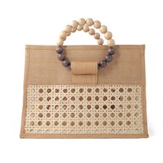 Welcoming the new stunning pearl, cream & white Ashley bag. This unique statement style will be sure to turn heads and have admirers asking you, 'where did you get that bag?' ! The unique combination of pearl shell inlay beads and wooden beads really does add an extra luxe vibe. It's the perfect statement piece for elevating your vacation style.  Crafted by our artisans in the Philippines, the structured bag is made from T’nalak fabric with an iconic Solihiya rattan weave overlay. Featuring wooden & shell inlay beaded top handles, the bag also comes with a drawstring fabric closure to keep everything safe and secure and a detachable thick crossbody strap - perfect for when you need a hands free option.  Detachable cross-body strap included Constructed with T'nalak fabric made from Abaca fi Beige Square Bag With Pearl Handle, Beige Square Bags With Bamboo Handle, Cream Rectangular Shoulder Bag With Pearl Handle, Cream Top Handle Bag With Pearl Detail, Cream Top Handle Bag With Pearl Handle, Beige Rectangular Shoulder Bag With Bamboo Handle, Beige Rectangular Bags With Bamboo Handle, Cream Bags With Pearl Handle For Daily Use, Rectangular Shoulder Bag With Pearl Handle For Shopping