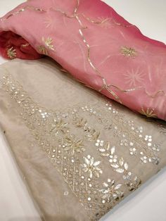 Item Overview Atharva Hand Embroidered Salwar Kameez w/Embroidery Neck in Beige/Dual shade Gota Patti work Dupatta/Custom Stitched/Bridal Trousseau/CH1219 Fabric: * Shirt Chanderi - 2.5 Mts Hand Embroidered Neck * Dupatta:Chiffon Chinnon Dupatta w/Gota Patti Work in 2.5 Mts Dual Shade * Bottom Santoon Silk 2.5 Mts. Excusive Hand Embroidered Party Wear Punjabi Suit. Customization: * Fabrics Customization: Designs Can be made in any Fabric of choice. * Color Customization: Design can be made in an Tissue Silk Straight Kurta With Mirror Work, Straight Kurta Churidar With Zari Work In Tissue Silk, Diwali Embroidered Kurta In Tissue Silk, Tissue Silk Kurta With Mirror Work For Diwali, Diwali Tissue Silk Kurta With Mirror Work, Celebration Kurta With Dupatta In Tissue Silk, Tissue Silk Kurta With Dupatta For Celebration, Diwali Embroidered Tissue Silk Kurta, Semi-stitched Chanderi Sharara With Mirror Work