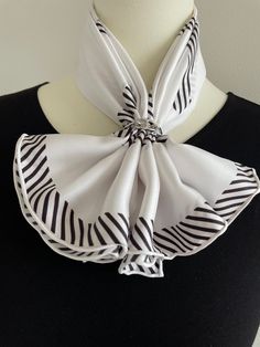 This 100% silk twill luxury square scarf with hand-rolled edges has a minimalist black and white stripes design. Could go well with any outfit.  Material: 100 % mulberry silk twill This scarf is made of 14 momme 100% mulberry silk which is heavier, softer, and more durable. Silk twill is one of the finest silk fabrics, woven with a pattern of diagonal parallel ribs for reinforced structure. Perfect gift for Valentine's Day, Mother's Day, Birthday, and Anniversary gifts. Size: 70 cm x 70 cm / 27 in x 27 in As this scarf is hand-rolled, the dimensions indicated may vary. Edges: Hand-Rolled  This essential accessory complements any outfit. Can style as a neck scarf, a head scarf, or at the waist. Suitable for all seasons, gift ideas for the holiday season, and special occasions. Care Instruct Elegant White Square Scarf, Elegant White Square Silk Scarf, Elegant Black Square Silk Scarf, Elegant White Handkerchiefs As Gift, Elegant White Handkerchiefs Gift, White Satin Silk Scarf Chic Style, Chic White Silk Satin Scarf, Chic White Satin Silk Scarf, Classic White Silk Scarf For Formal Occasions